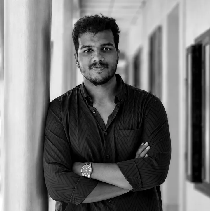 Mrudul, founder of Skaylon Technology, standing in a corridor with arms folded